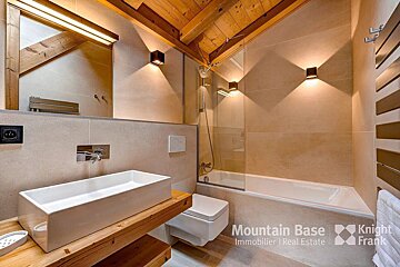 A bathroom with a knight frank logo on the bottom