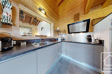 A kitchen with the word alpine on the bottom