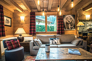 A living room with a painting of a bear on the wall