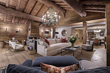 A living room filled with furniture and a chandelier