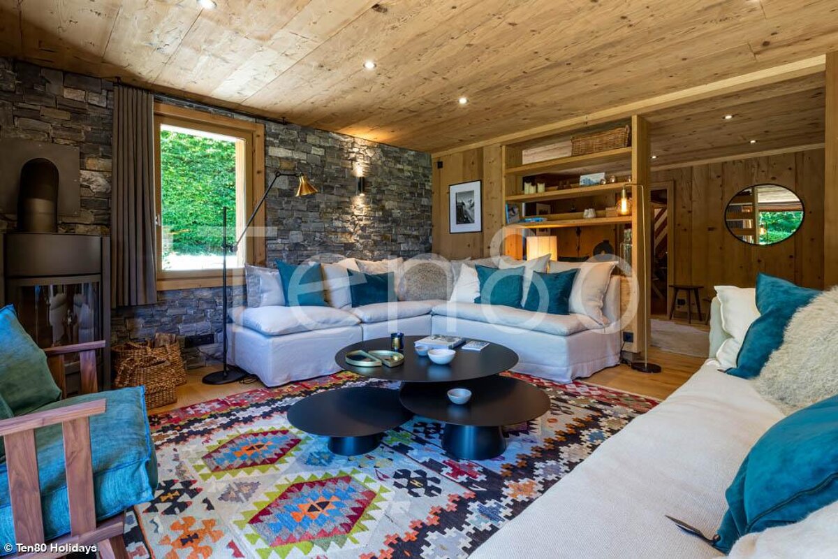 A living room with a couch and two coffee tables