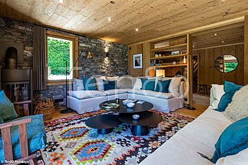 A living room with a couch and two coffee tables