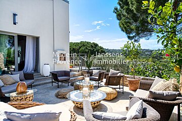 A patio with furniture and a sign that says made in provence