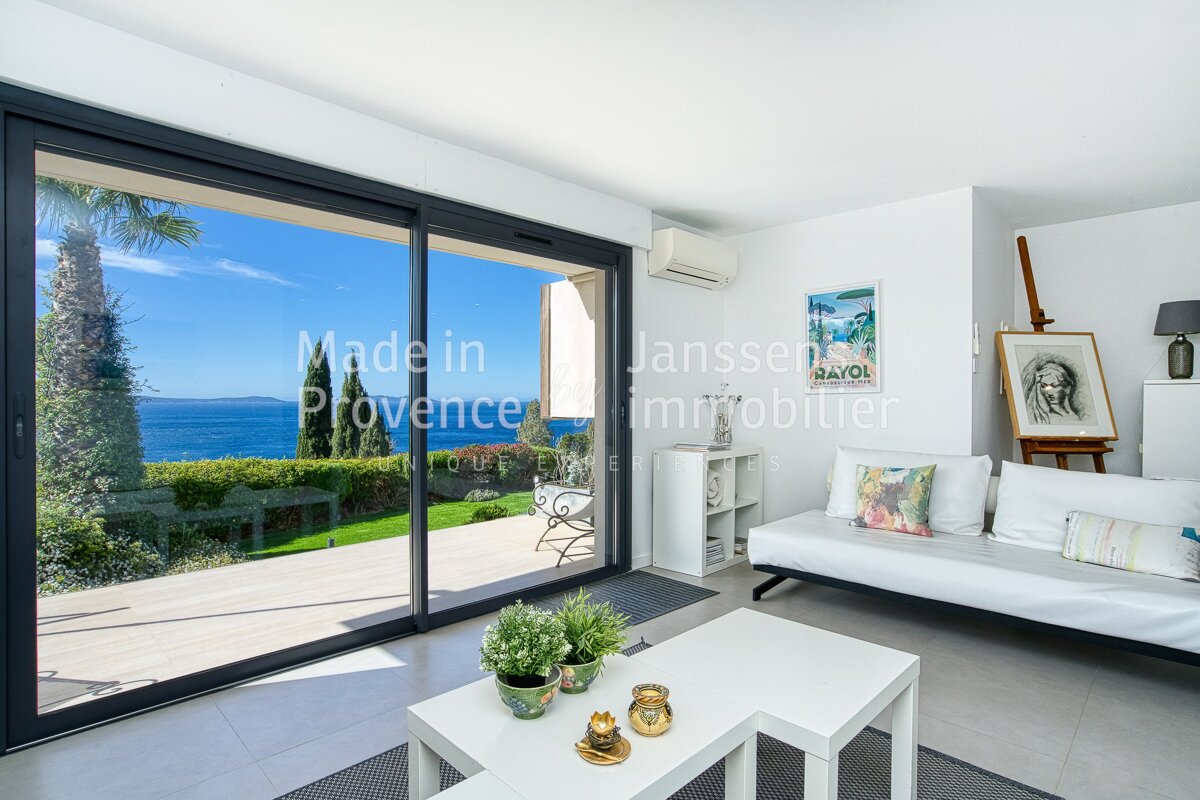 A living room with a sliding glass door that says made in provence