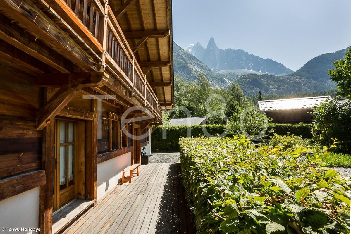 A picture of a house with mountains in the background taken by ten60 holidays