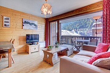 A living room with a couch and a flat screen tv