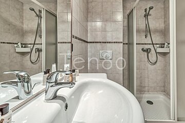 A bathroom with the word tengo on the wall