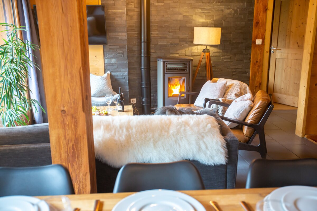 A living room with a fireplace and a couch