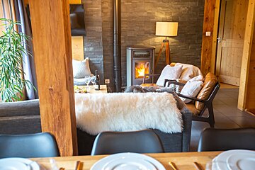 A living room with a fireplace and a couch