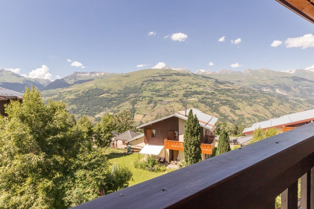 A balcony with a view of a mountain range