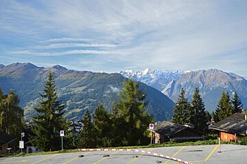 A parking lot with a mountain in the background
