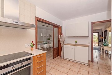 A kitchen with a stove top oven that says ' bosch ' on it