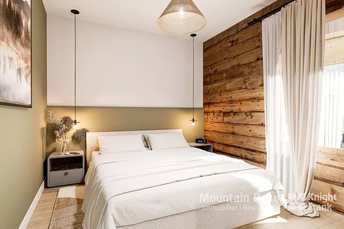 A bedroom with a wooden wall and a bed with white sheets