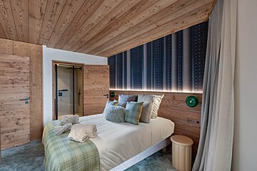 An artist 's impression of a room with a swimming pool