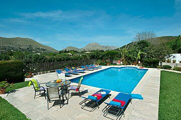 A large swimming pool with mountains in the background