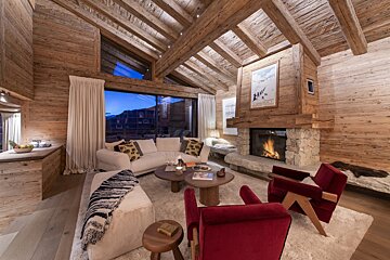 A living room with a fireplace and a couch