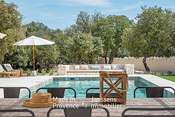 A swimming pool with the words made in provence by immobilier