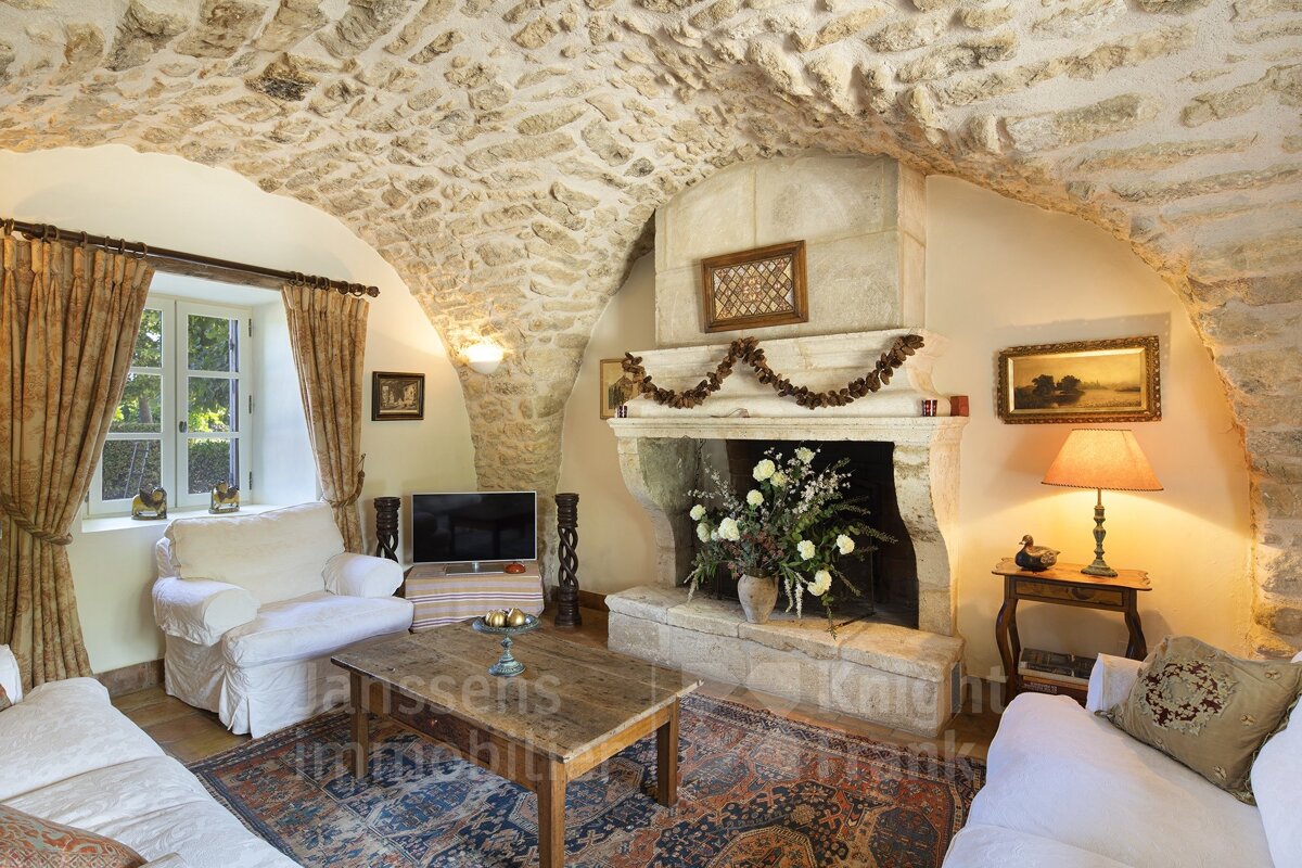 A living room with a fireplace and a couch that says knight