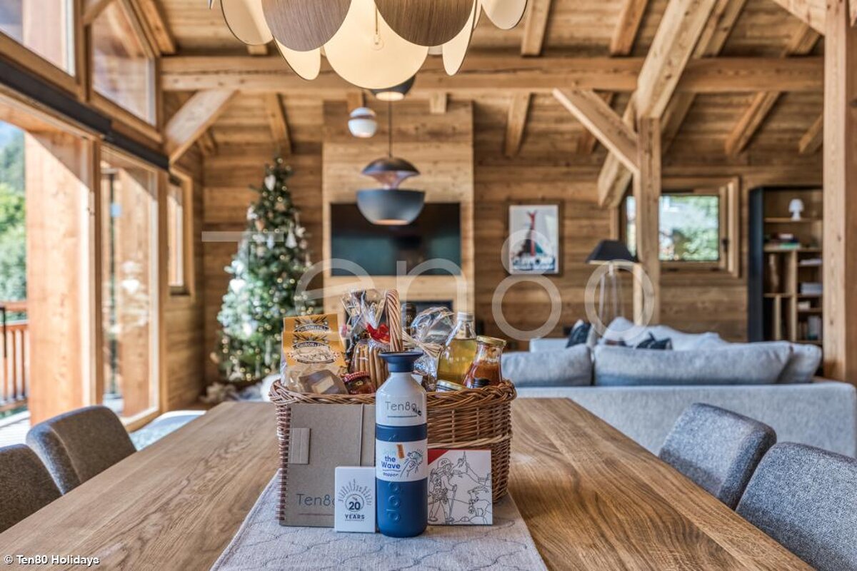 A basket on a table with a bottle that says tense on it