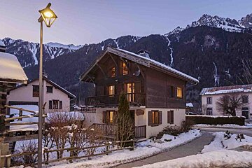 A house with a sign that says ' chalet ' on it