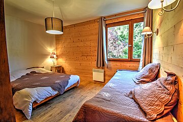 A bedroom with a bed and a couch in it