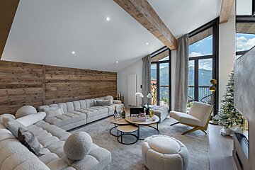 A living room filled with furniture and a christmas tree