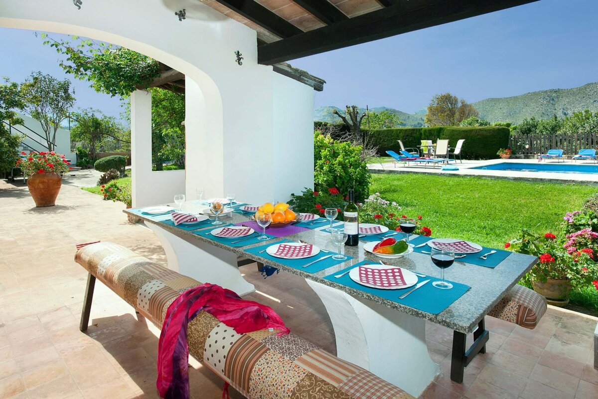 A table with plates and glasses of wine on it