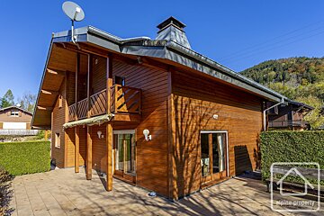 A wooden house with the word alpine property on it