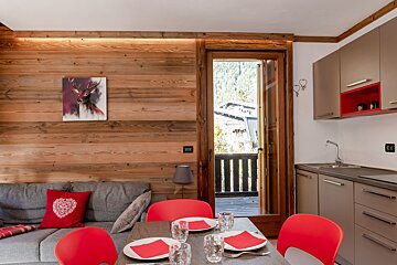 A living room with a painting of a deer on the wall