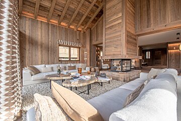 A living room filled with furniture and a fireplace