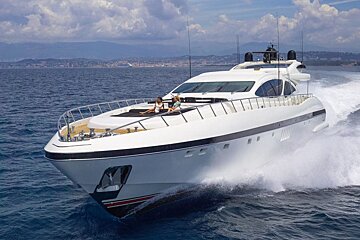 A couple sits on a yacht in the ocean