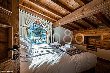 A bedroom with the number 80 on the wall