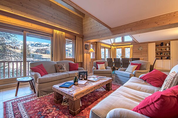 A living room with a couch a chair and a coffee table