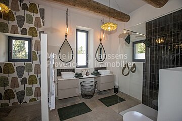 A bathroom with the words made in vanssens provence immobilier on the bottom