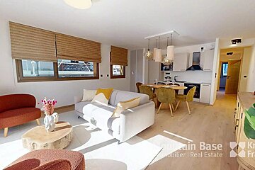 A living room with a couch and a table that says mountain base