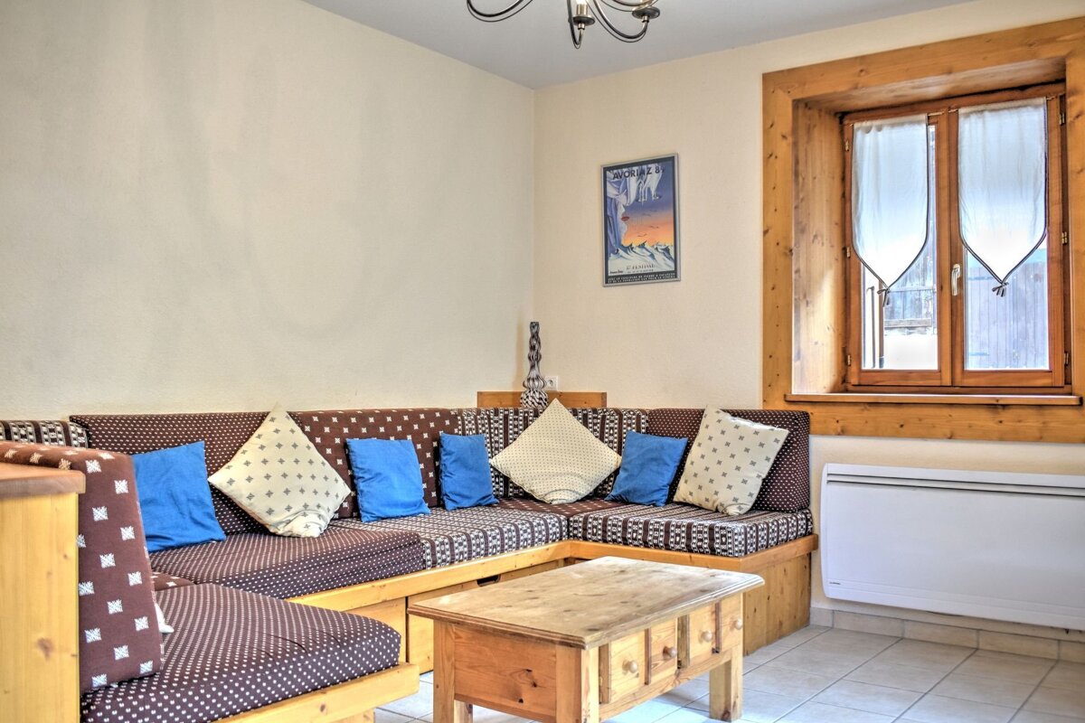 A living room with a couch and a coffee table