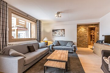 A living room with a couch and a coffee table