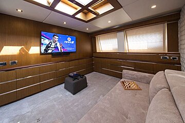 A living room with a flat screen tv that says fifa 18 on it