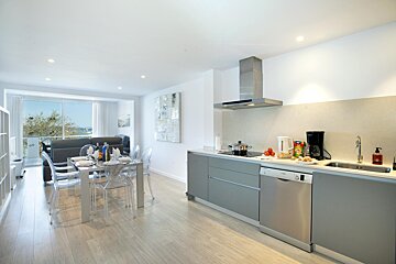A kitchen with stainless steel appliances including a dishwasher