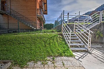 A set of metal stairs leading up to a building