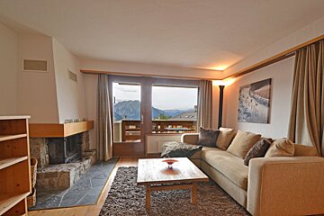 A living room with a couch and a fireplace