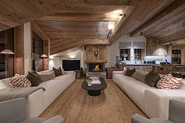 A living room filled with furniture and a fireplace