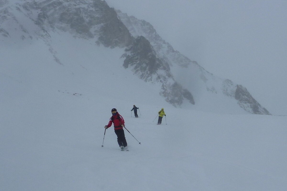 skiers in the mist