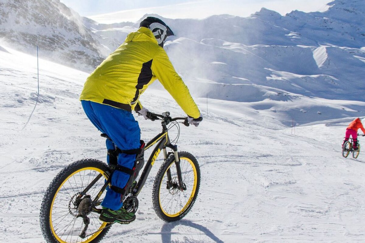 biking on snow in a ski resort