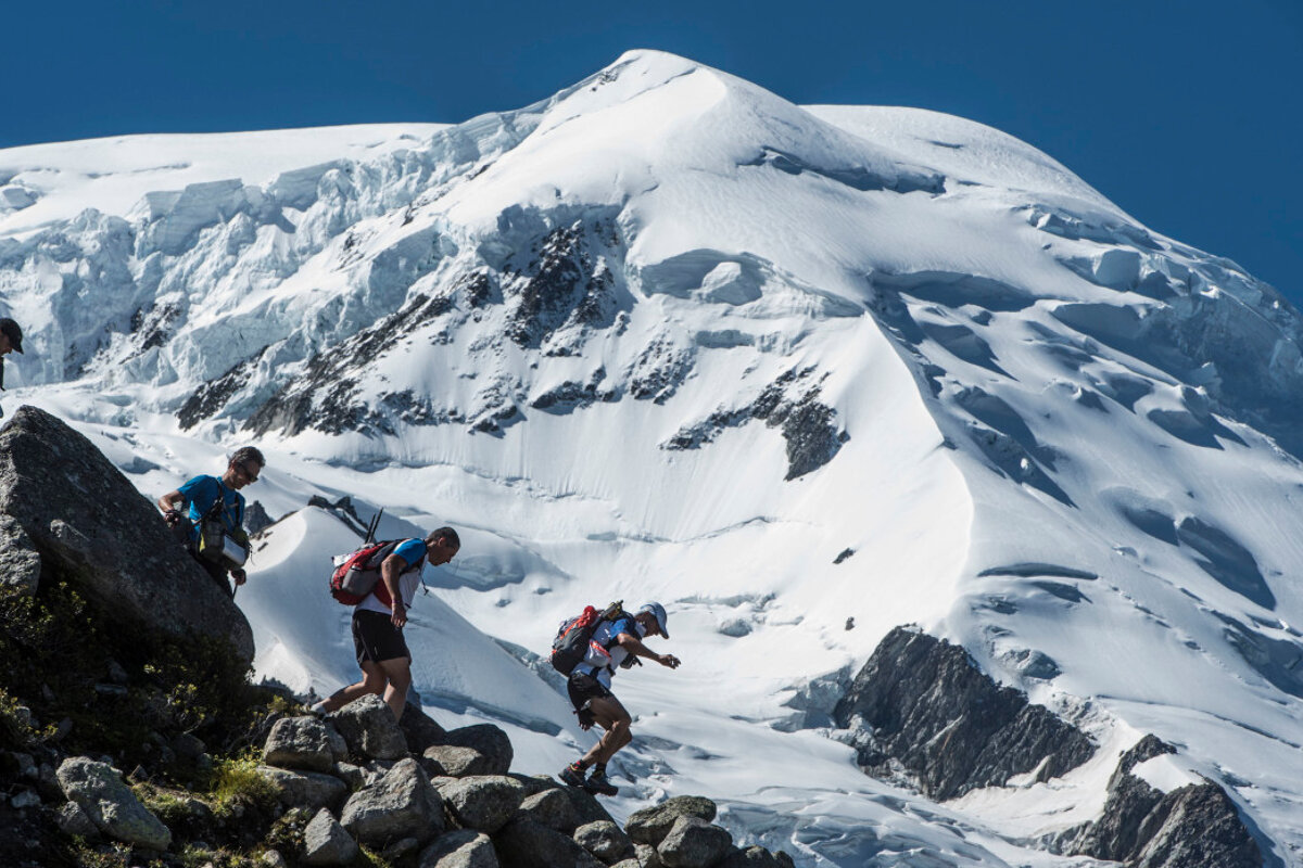 trail runners in front of Mont Blanc