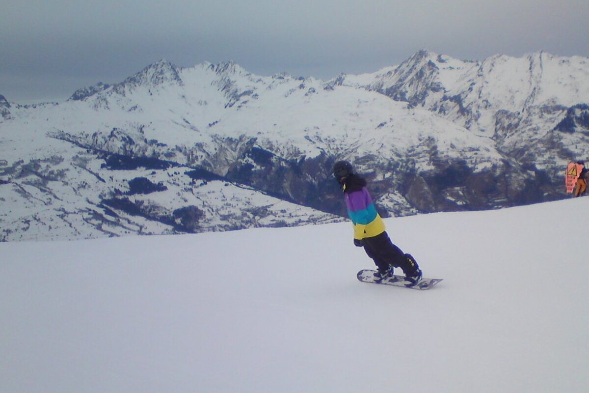 a snowboarder in a colourful jacket