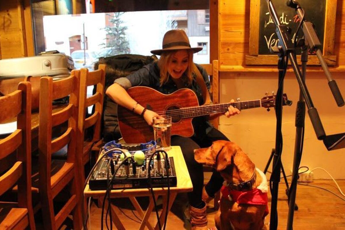 a guitarist in a bar