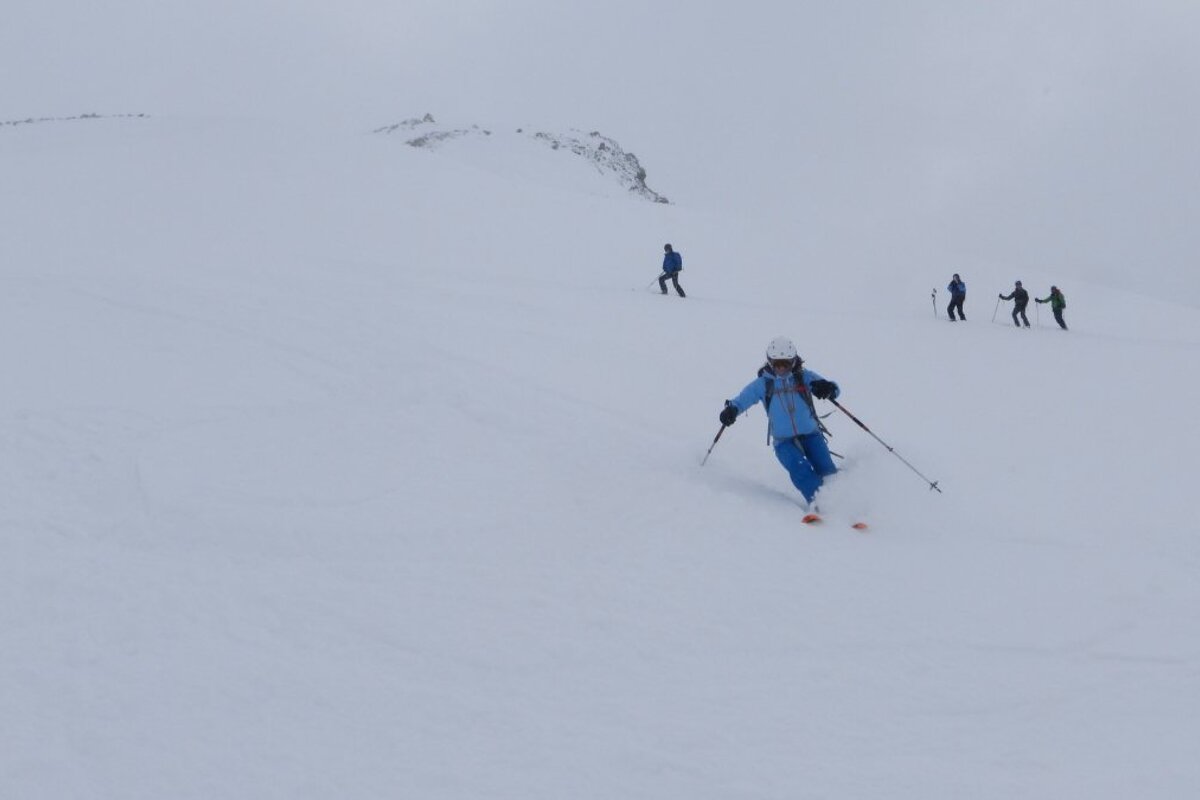 skiers in low cloud