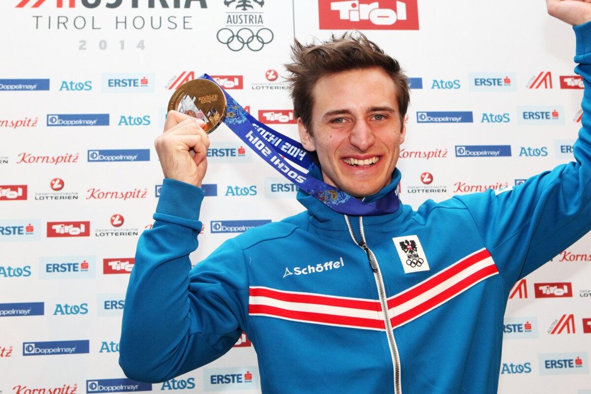 a ski racer with an olympic medal