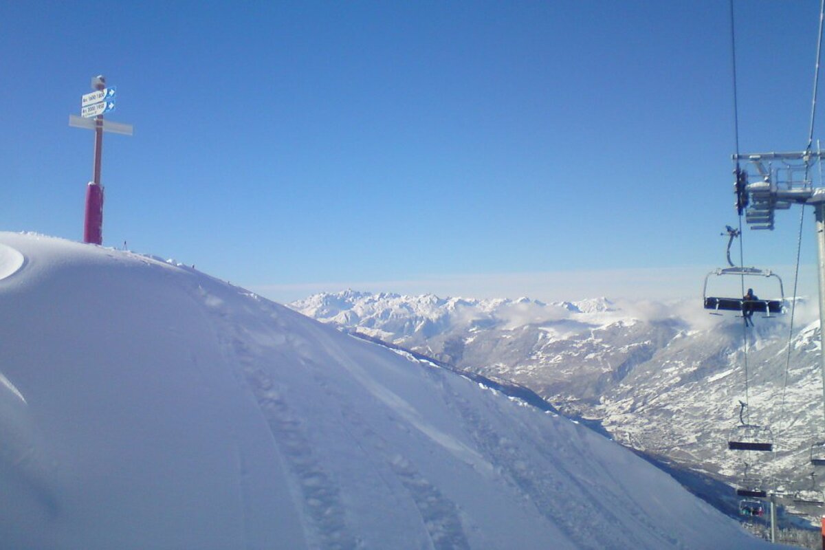 fresh ski tracks near a lift